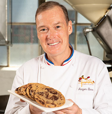 Chef Jacques Torres holding plate of Chocolate Chip Cookies