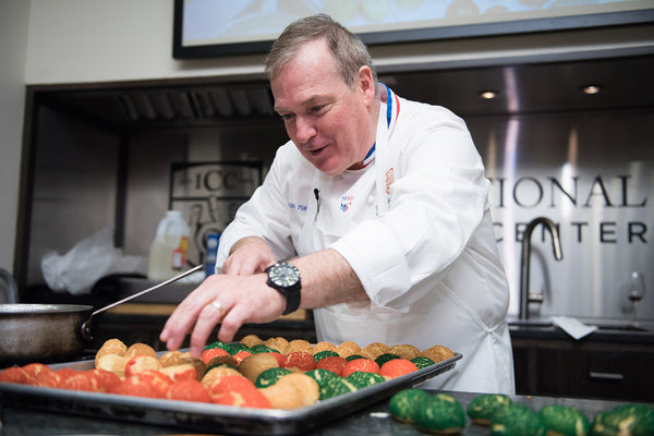Jacques demonstrating how to make a Croquembouche