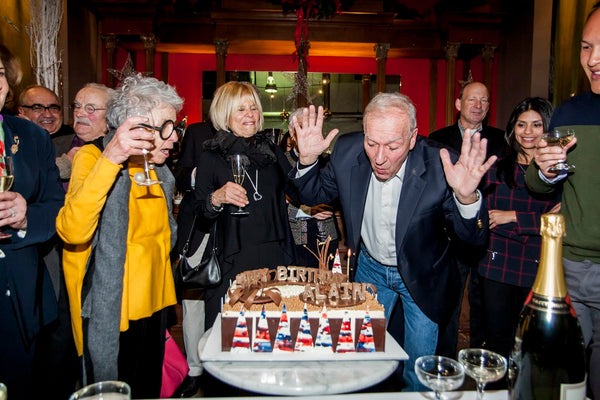 Chef Alain Sailhac Blows out the candles on his 80th Birthday Cake